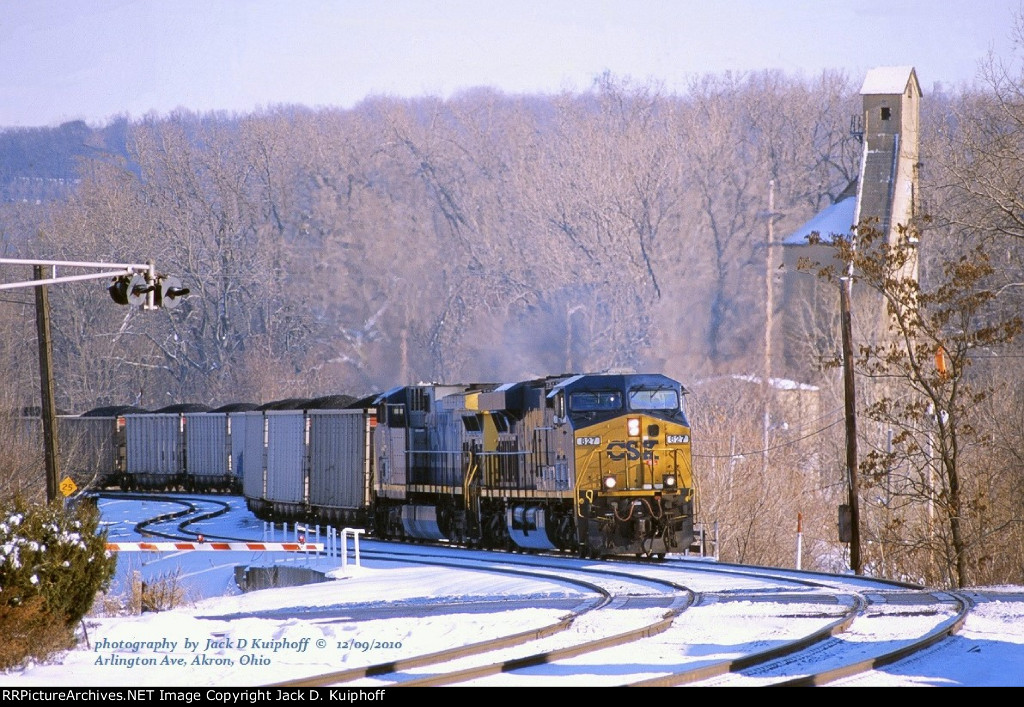 CSX 827- 75 with a westbound coal train at N.Arlington Street crossing, AY, Akron, Ohio. December 9, 2010. 